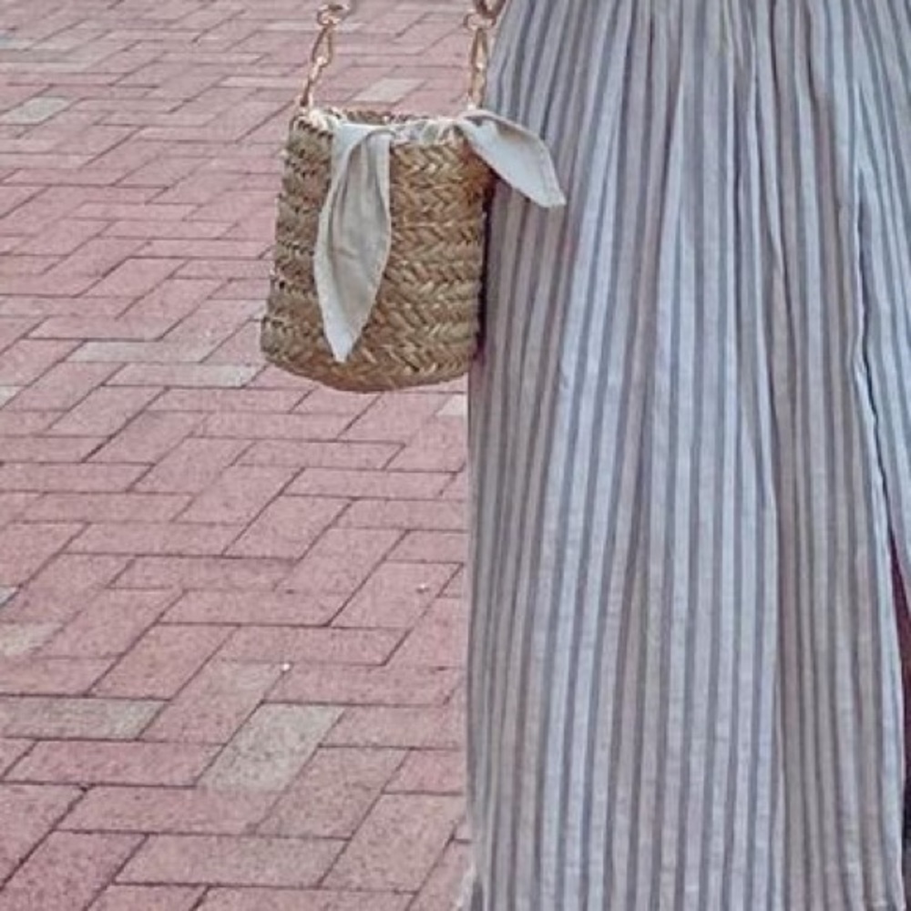 Raffia bucket bag with optional strap and pom pom tassel